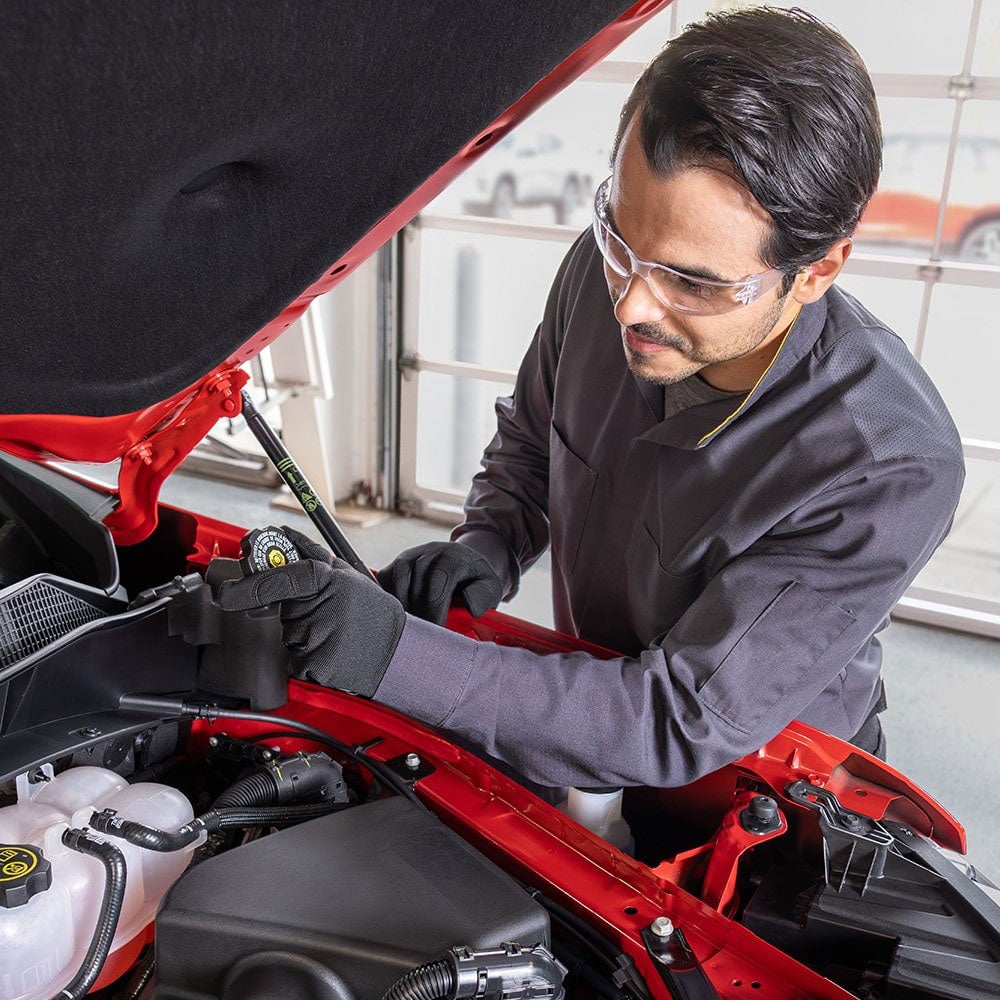 Service employee working on a car